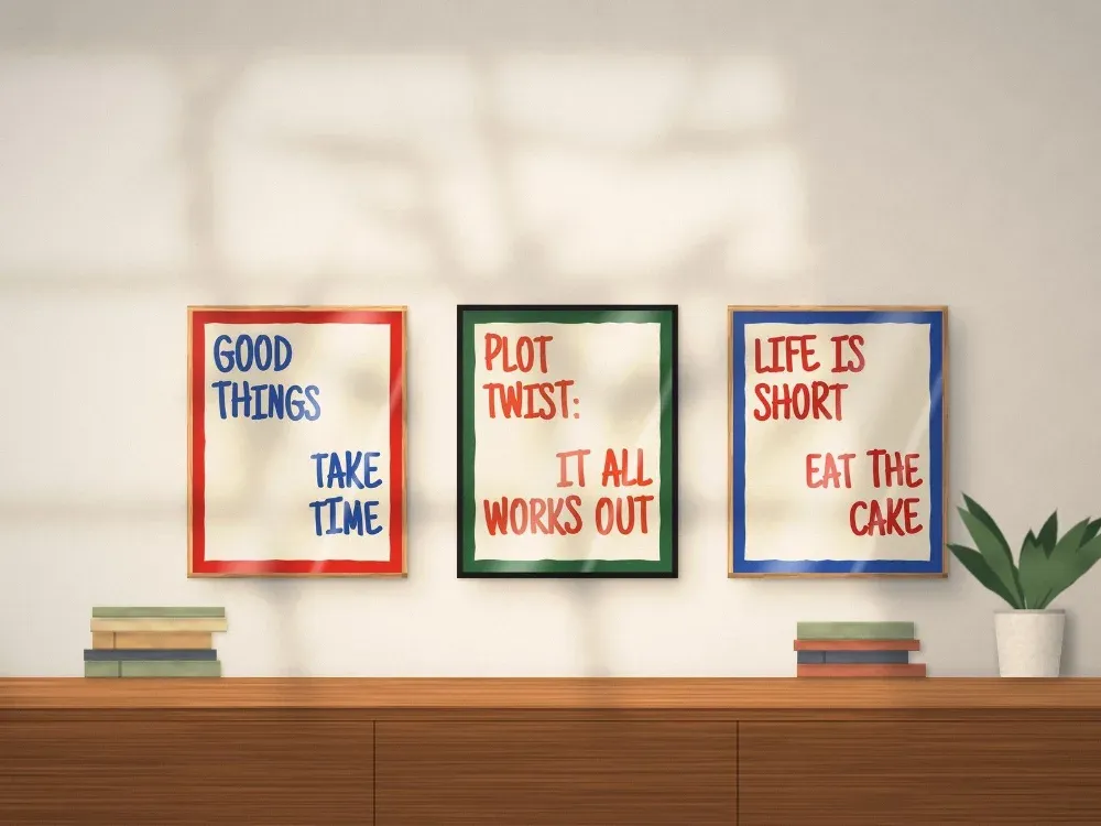 Three bold hand-painted Pep Talk quote prints framed above a sideboard